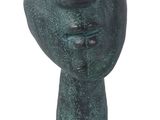 statue of a hand holding a ball on a white background