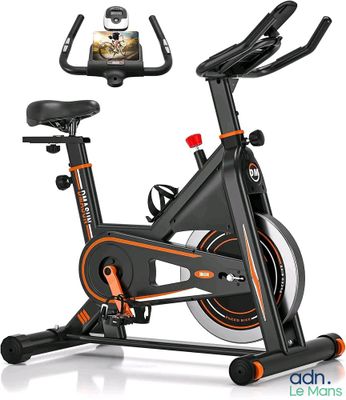 a close up of a stationary exercise bike with a cell phone on it