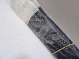 a black and white picture of a roll of paper