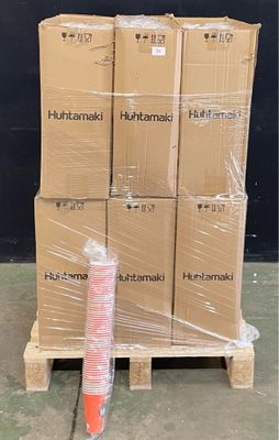 boxes stacked on pallets in a warehouse with plastic wrap around them