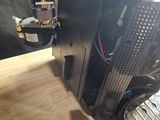 a computer that is sitting on a wooden table