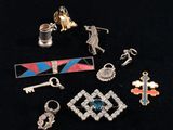 several different types of jewelry are displayed on a black surface