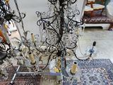 a chandelier that is sitting on a rug in a room
