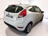 the back of a white ford fiesta parked in a white room