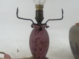 a lamp that is sitting on a table next to a vase
