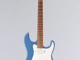 a blue electric guitar sitting on top of a stand