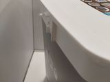 a white toilet with stickers on it in a bathroom
