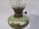 a glass lamp that is sitting on a table