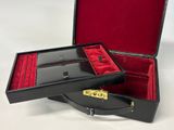 a black case with red velvet linings and a gold clasp