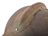 a close up of a helmet with a leaf on it