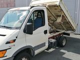 a white truck that is parked in front of a building