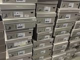 boxes stacked on top of each other in a warehouse