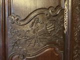 a close up of a wooden door with carvings on it