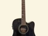 a black acoustic guitar on a white background
