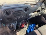 a dashboard of a vehicle with a blue bag in the passenger seat