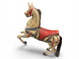 statue of a horse with a saddle on its back on a white background