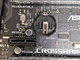 a close up of a computer motherboard with a power plug