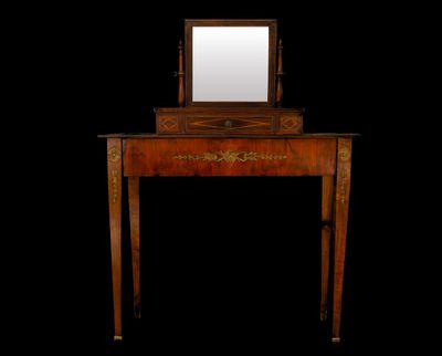 a small wooden table with a mirror on top of it