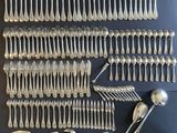 an assortment of silverware including forks, spoons and spoons