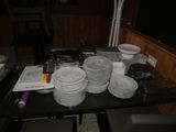 a table with a lot of plates and bowls on it