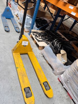 two pallets that are sitting on the floor in a warehouse