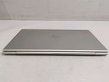 a laptop that is sitting on a white surface