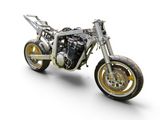 a silver and yellow motorcycle on a white background