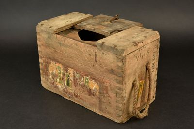 an old wooden box that has a tissue dispenser in it