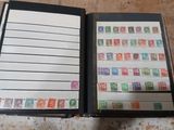 a book with stamps on it sitting on a table