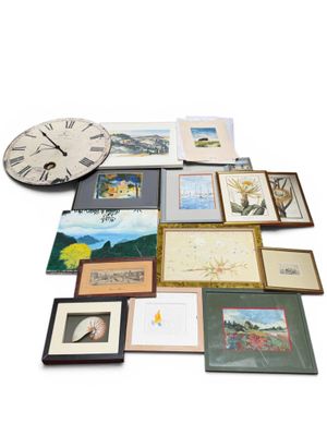 a large collection of framed and unframed art on a white surface