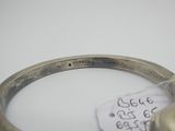 une photo d'un bracelet en argent muni d'une étiquette