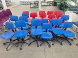many chairs arranged in a circle in the middle of a room