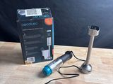 a box and a cord connected to a microphone on a table