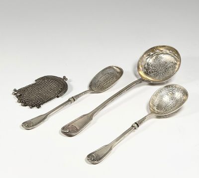 three silver spoons and a teaspoon on a white surface