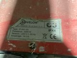 a label on the back of a machine that is sitting on a table