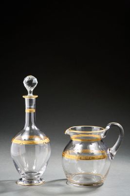 pair of cut glass decanters and a decanter on a table