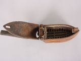 a small metal object that is on a white surface