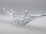 clear glass bowl sitting on a white surface with a white background