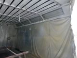 a picture of a room that is covered in plastic