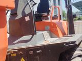 an image of a forklift parked outside of a building