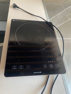 a black stove top with a black burner on it