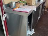 an image of a kitchen with a lot of clutter