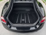 the back of a car with its trunk open on the road