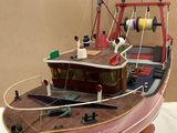 a model of a boat on display on a table