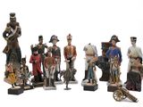 many figurines of different sizes and colors on display