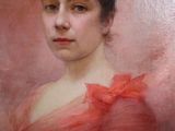 painting of a woman in a red dress in a gold frame