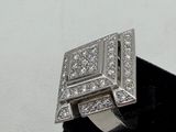 an image of a diamond ring on a black velvet ring stand