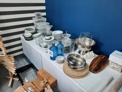 a table with a lot of dishes and bowls on it