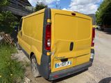 a yellow van that is parked on the side of the road