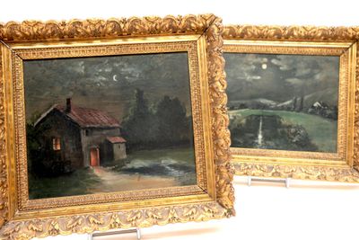 two framed paintings of a house and a barn in a field